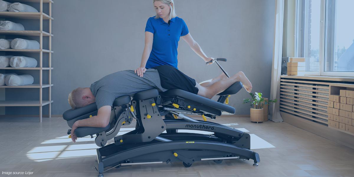 Clinician using tilt and gravity positioning on a treatment table